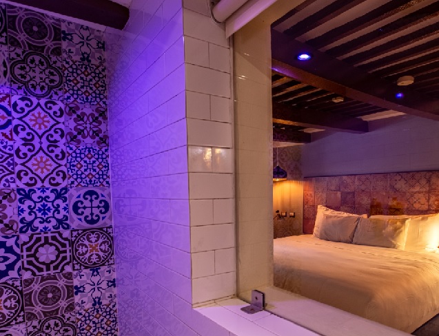 “Rainforest-style shower with chromotherapy lighting overlooking the luxurious.”