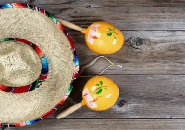 “A traditional Mexican sombrero paired with colorful maracas, symbolizing festive Mexican culture.”